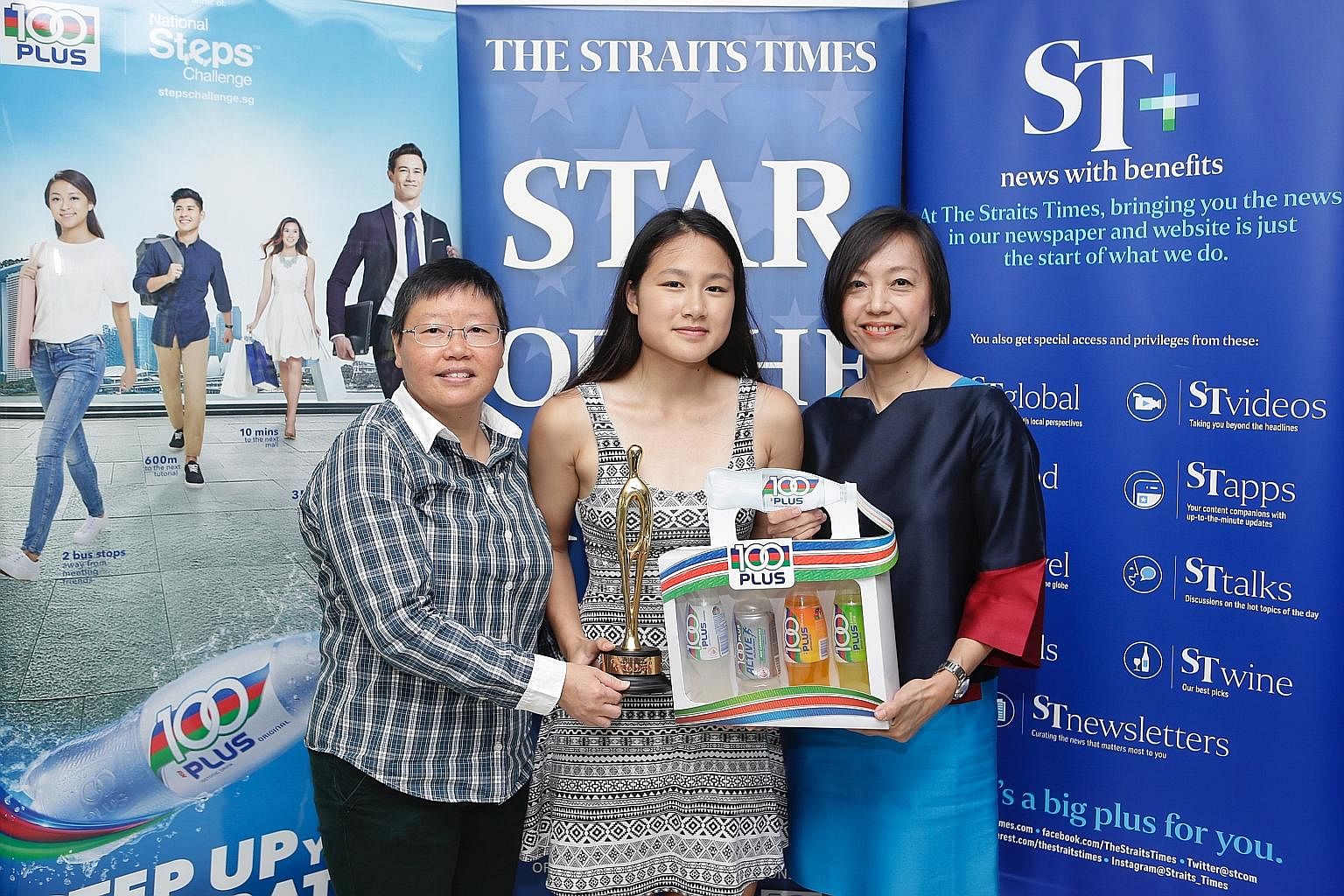 Cheyenne Goh, with ST sports editor Lee Yulin (left) and F&N Foods general manager Jennifer See, proudly holding her trophy and hamper for being the ST Star of the Month for November. She qualified for the Winter Games mainly on the strength of her 2