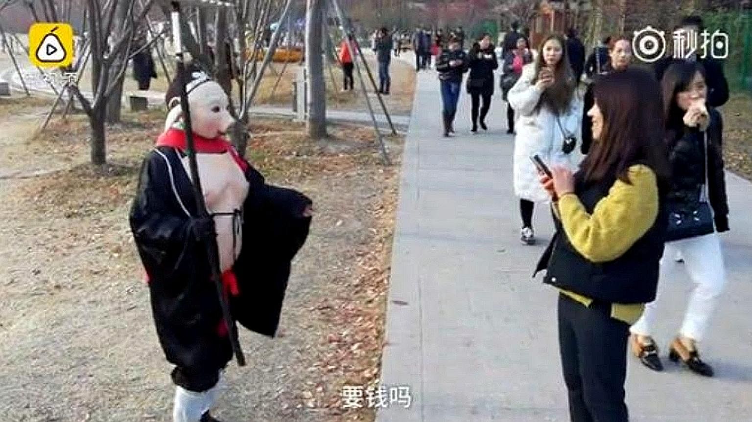Ms Wu Xiue dresses as fictional character Pigsy from the classic tale Journey To The West to raise money for her mentally ill husband and son. Ariel Olivar's six-second video (left), posted on Dec 2, shows her stepping on an imaginary box on one leg 
