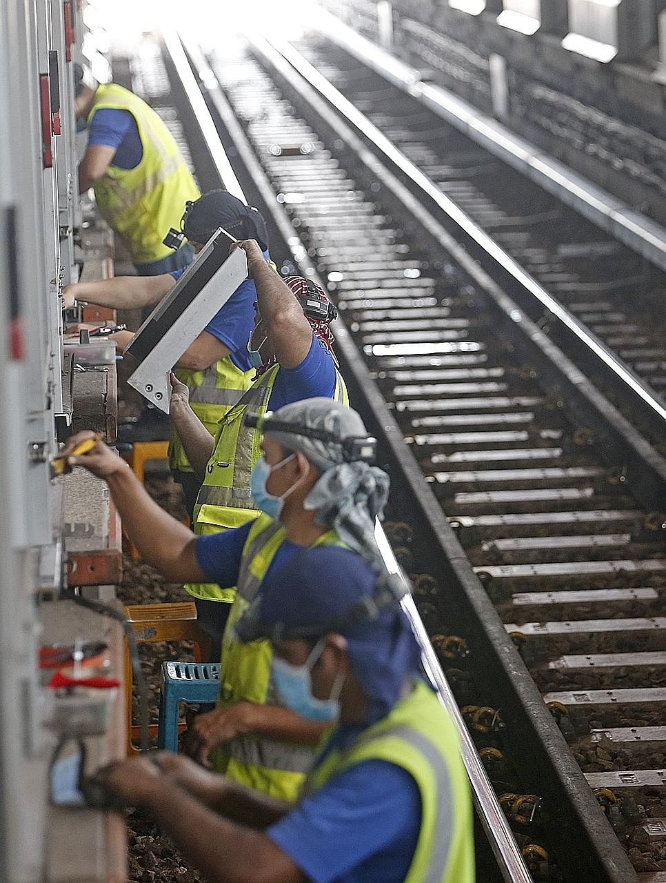 Maintenance work being done at Jurong East station yesterday. Overall, the first weekend of planned service disruptions went smoothly although many commuters were caught off guard.