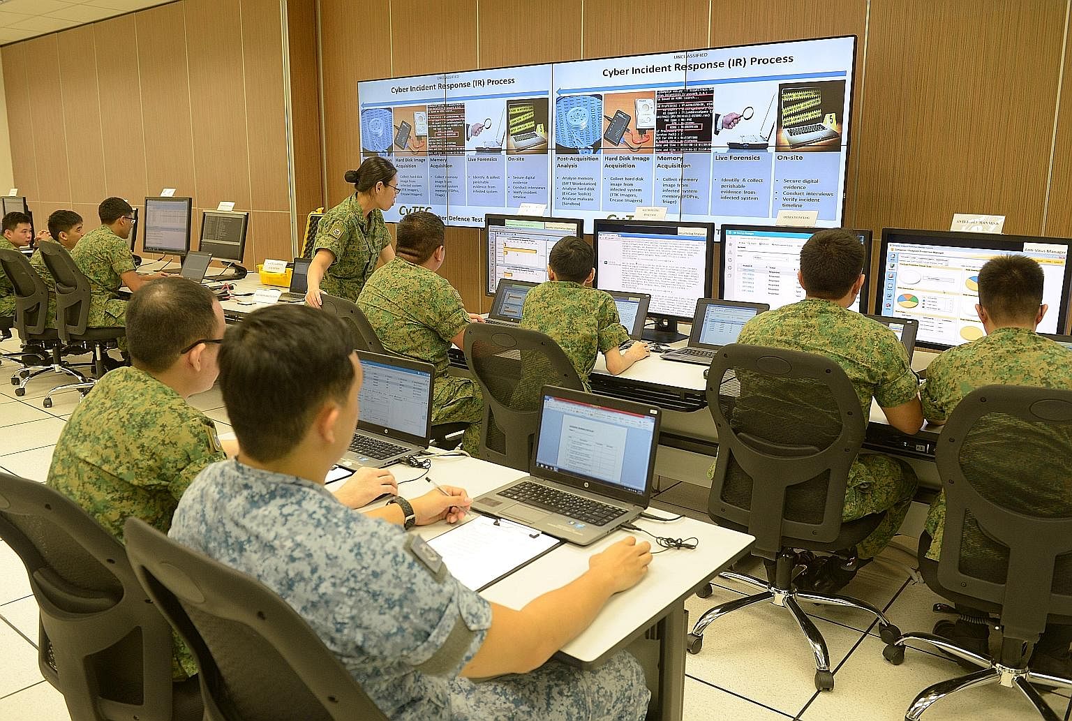 Soldiers at a demonstration yesterday to show how they would handle cyber threats at the Cyber Defence Test and Evaluation Centre, a cyber "live-firing range" located at Stagmont Camp.