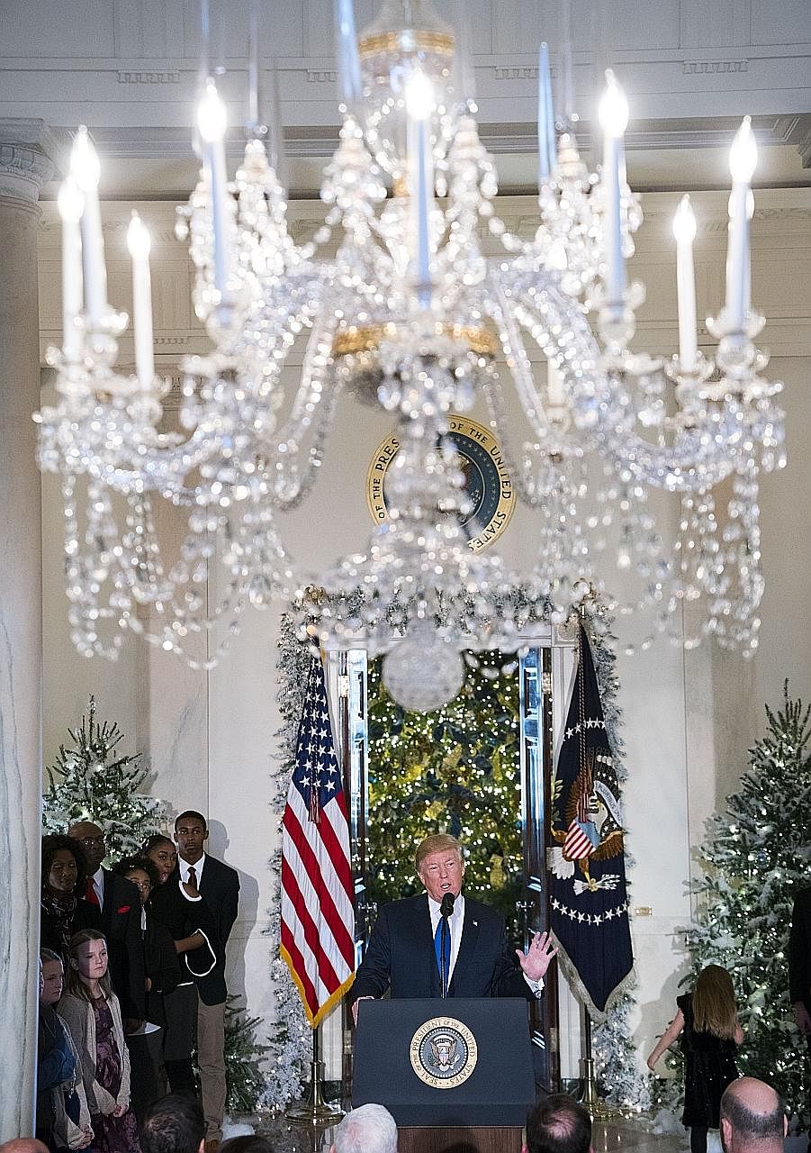 President Donald Trump, flanked by middle-class American families who would benefit from the tax cuts, making a strong pitch on Wednesday for the tax Bill to be ready by Christmas.