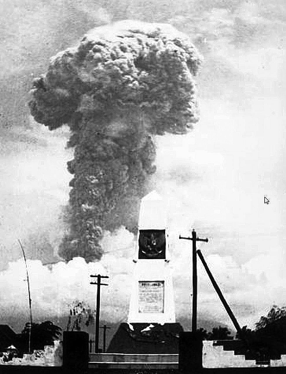 An eruption column towering over Mount Agung on March 12, 1963. The major eruption of the Indonesian volcano that year left about 1,700 people dead and destroyed several villages.