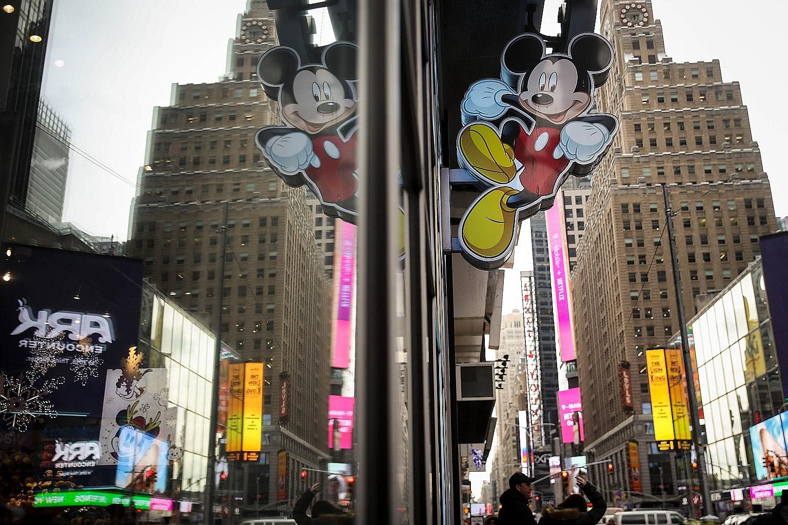 An image of Mickey Mouse outside the Disney Store in Times Square, New York. Disney is doubling down on broadcast and cable with the Fox acquisition.
