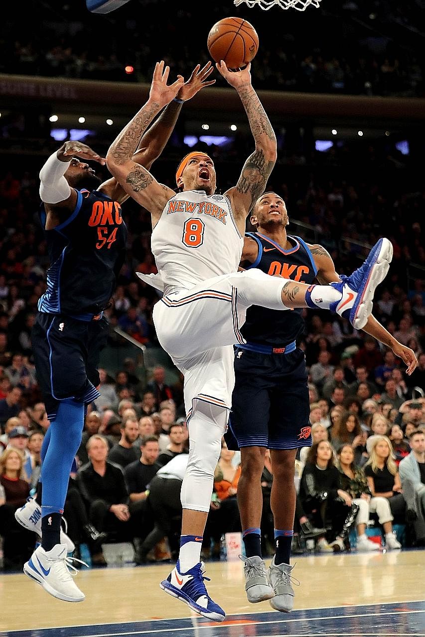 New York's Michael Beasley going for a shot as Oklahoma City's Patrick Patterson (far left) and Josh Huestis attempt to block him. While the Knicks won by 15 points, they only managed to take charge late in the third quarter.