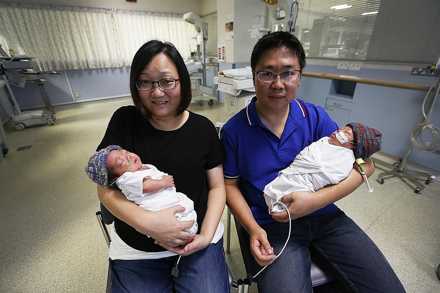 Mr Damion Lee and his wife Connie Lim with their twin boys Josias (left) and Elias, who were born in August at just 26 weeks. The babies were in the neonatal intensive care unit in KK Women's and Children's Hospital for almost two months.