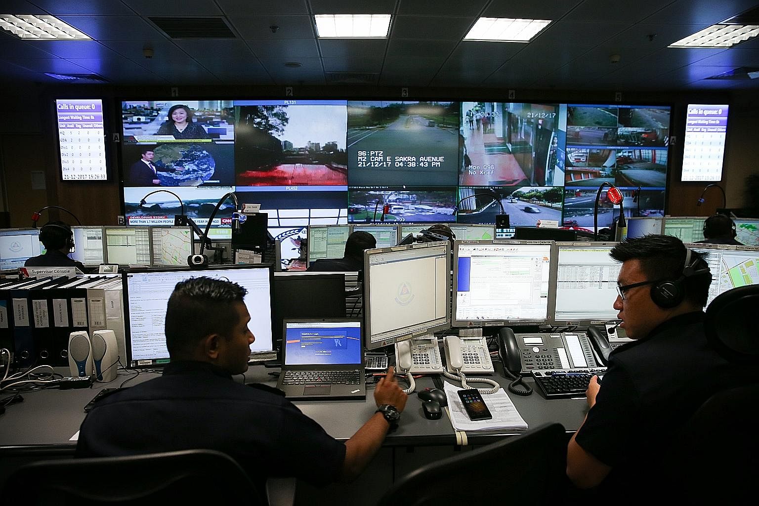 The SCDF Operations Centre is housed in a room barely the size of a tennis court and has a panel of video screens on the wall showing footage from security cameras around the island. The staff who man the centre adhere to strict timing targets.