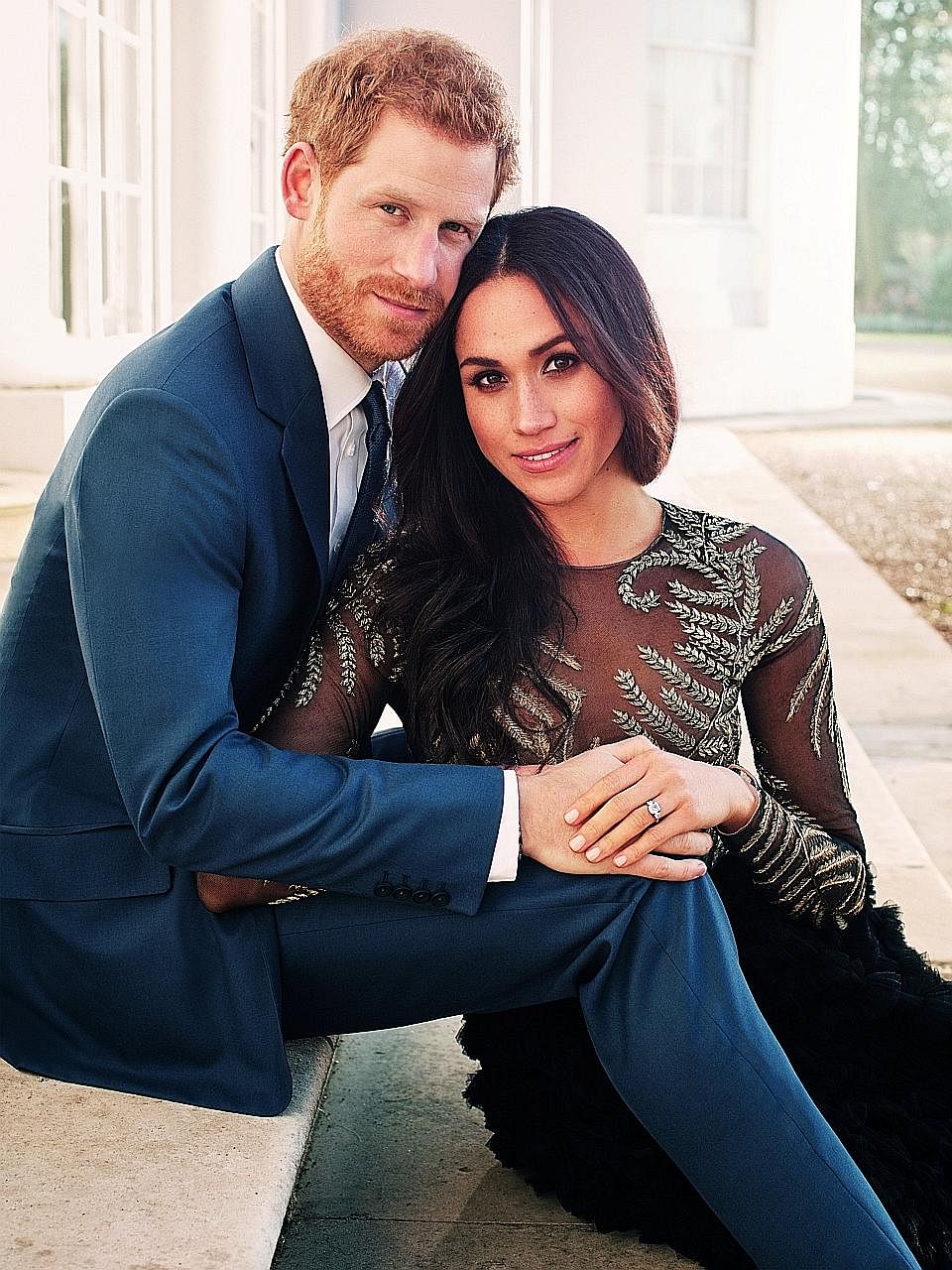 An engagement photo of Britain's Prince Harry and his fiancee, Meghan Markle, shows the latter in a sheer top.