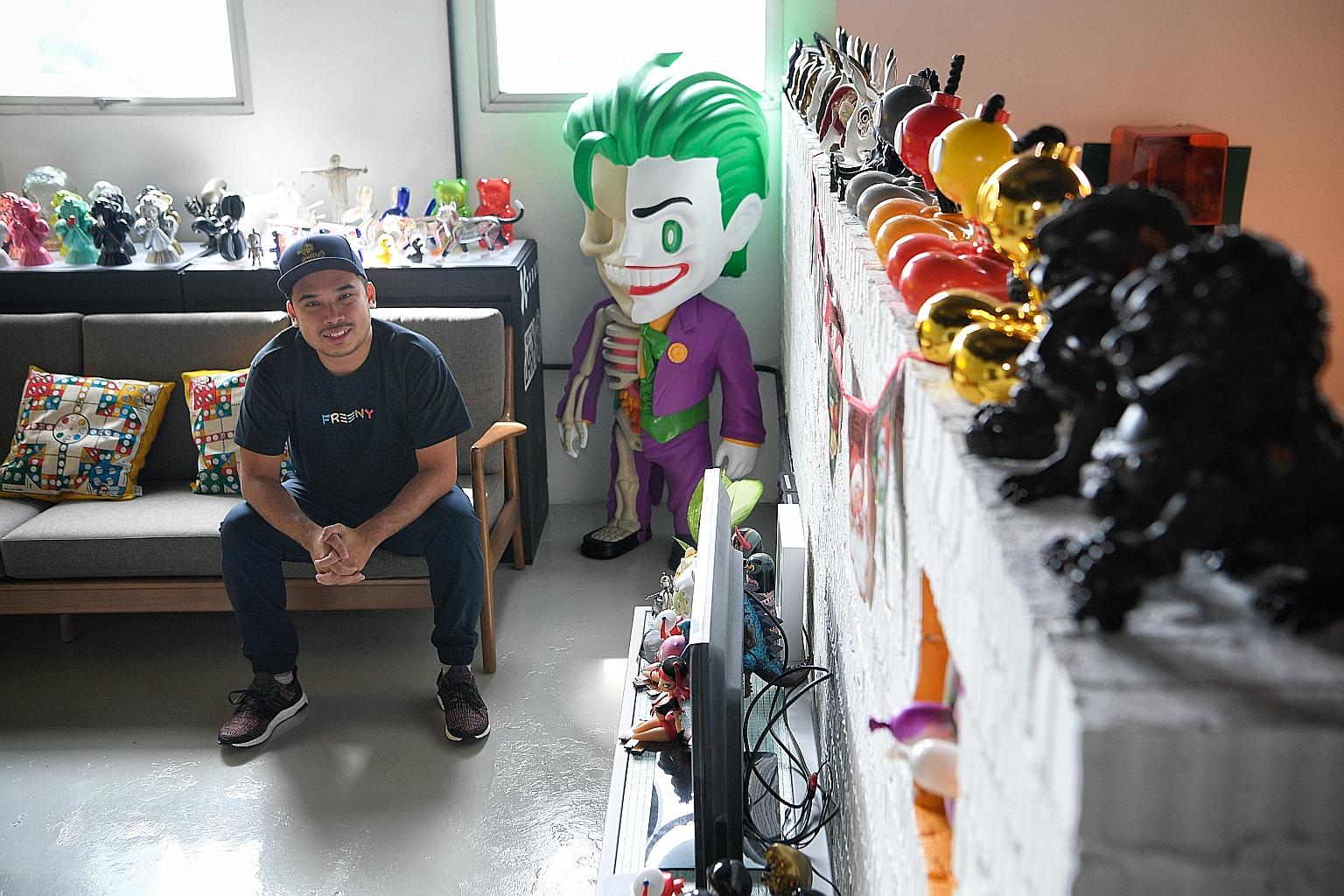 Mr Jackson Aw, 28, founder of local designer toy company Mighty Jaxx, at his office in Prosper House, Geylang, next to an XXRAY figure of the Joker. The company, which now works with brands like Warner Bros and is projected to hit $5 million in reven