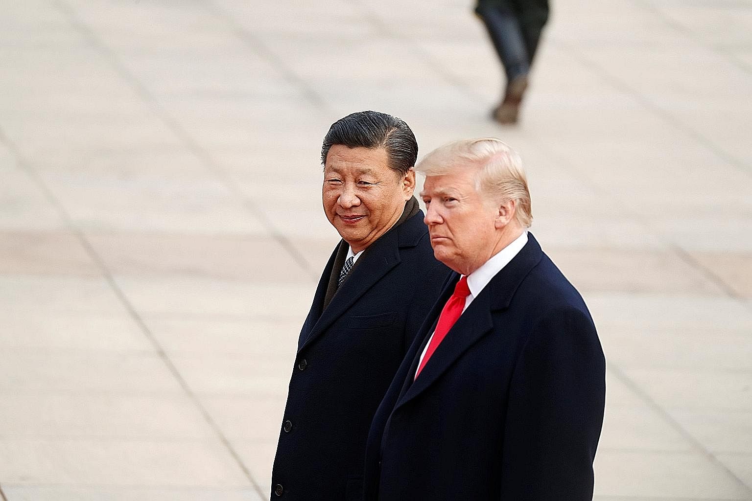 US President Donald Trump with his Chinese counterpart Xi Jinping during a visit to Beijing last year. Geopolitical analyst Ian Bremmer expects to see Mr Trump take a harder line on China with a series of tougher trade moves.