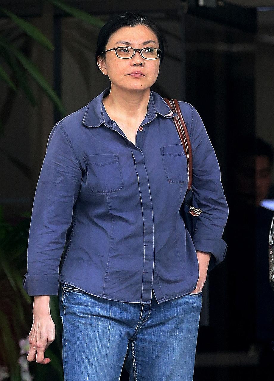 Koh Sock Buay was jailed 14 weeks for dishonestly misappropriating $26,822 and trying to bite a police officer's hand.