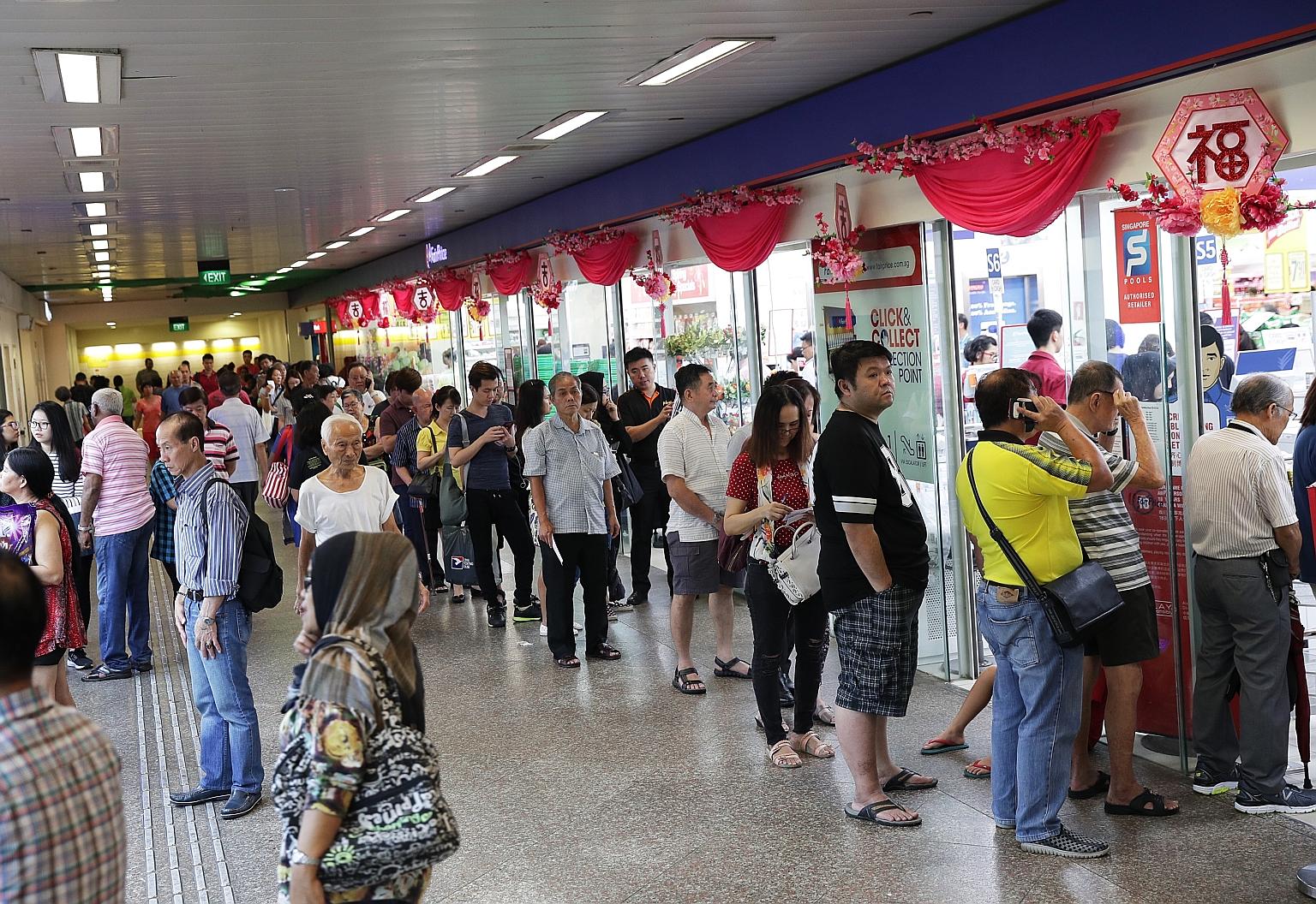 Long queues formed at NTUC FairPrice in Toa Payoh Central yesterday for tomorrow's $9.7 million New Year draw. On its website, Singapore Pools said punters could start placing bets from Tuesday this week at all its branches, authorised retailers and