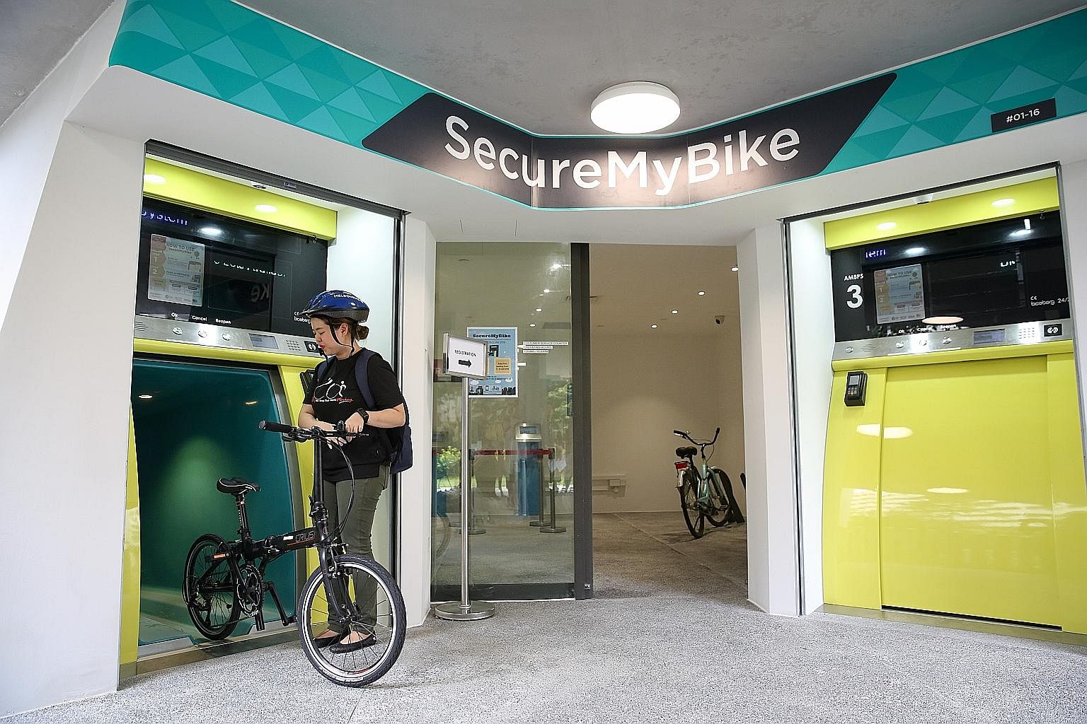 There are three kiosks at Kampung Admiralty. Each storage cell can take one bicycle and gear such as helmets or shoes.