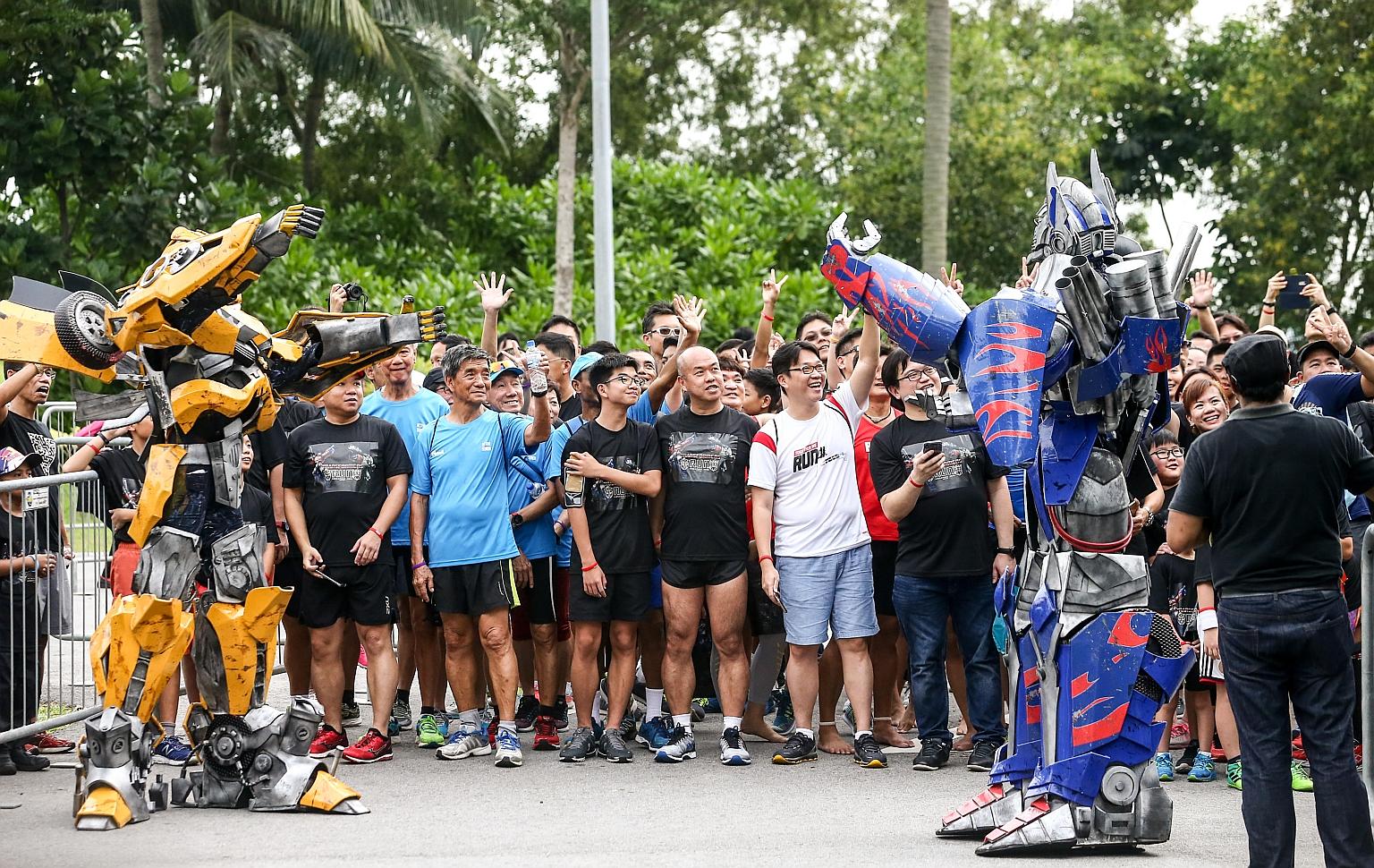 Giant robots descended on Palawan Beach in Sentosa alongside more than 3,500 people in the first Transformers Run Singapore yesterday. Vulnerable families, volunteers and people with disabilities were among those who took part in the 5km fun run and 