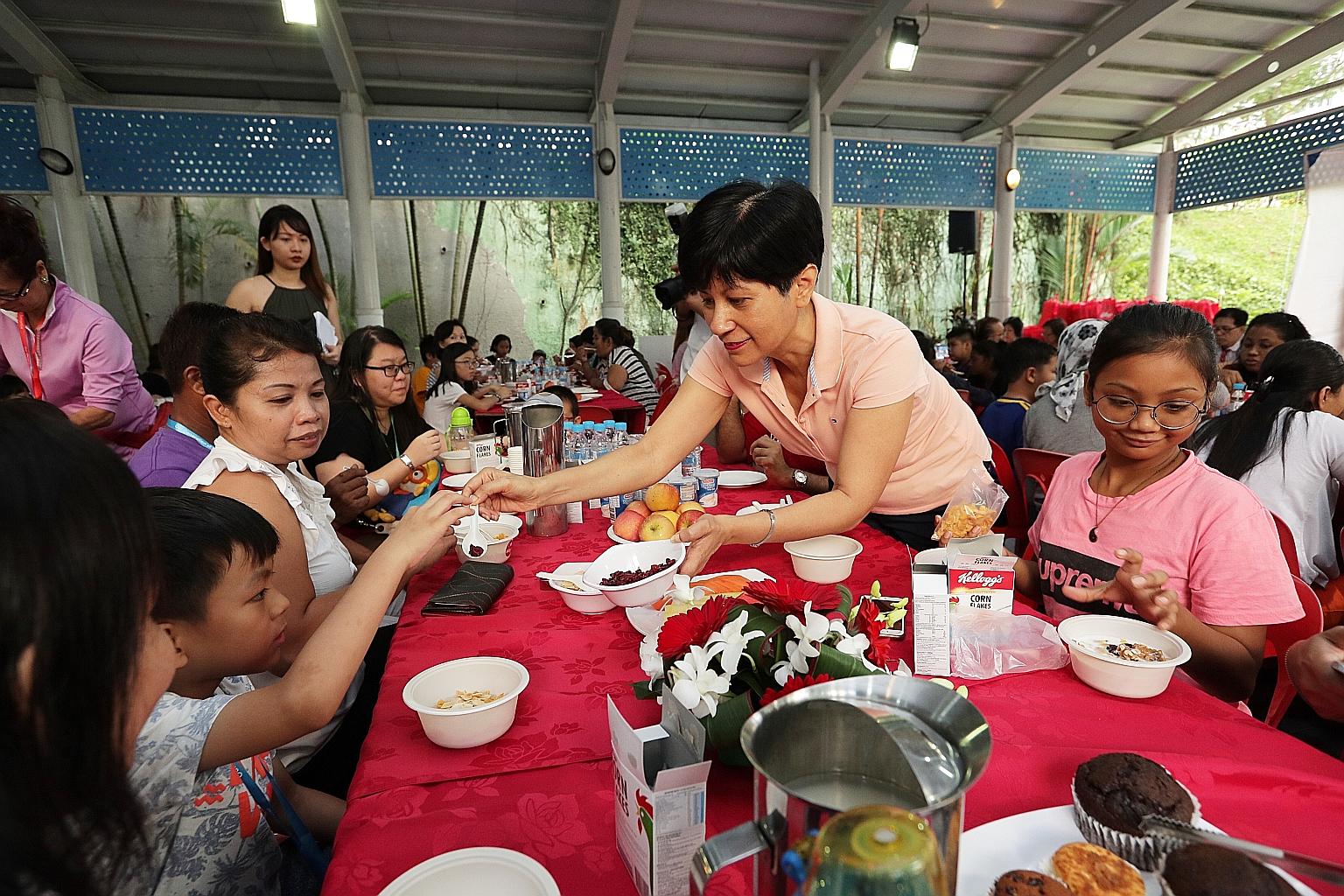 Senior Minister of State for Finance and Law Indranee Rajah at the launch of a programme yesterday to provide breakfast for children living in rental blocks in Tanjong Pagar GRC, which she represents as an MP.