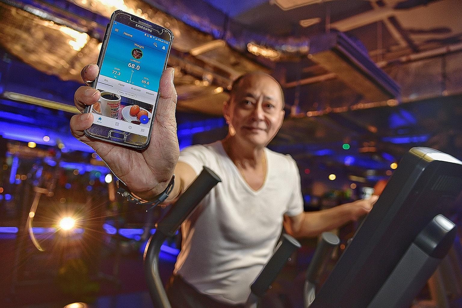 Mr Albert Koh, who is diabetic, lost nearly 10kg with the help of the GlycoLeap app, which has been giving him advice on his meal choices. The app helps diabetics improve their diets by assessing their daily meals.