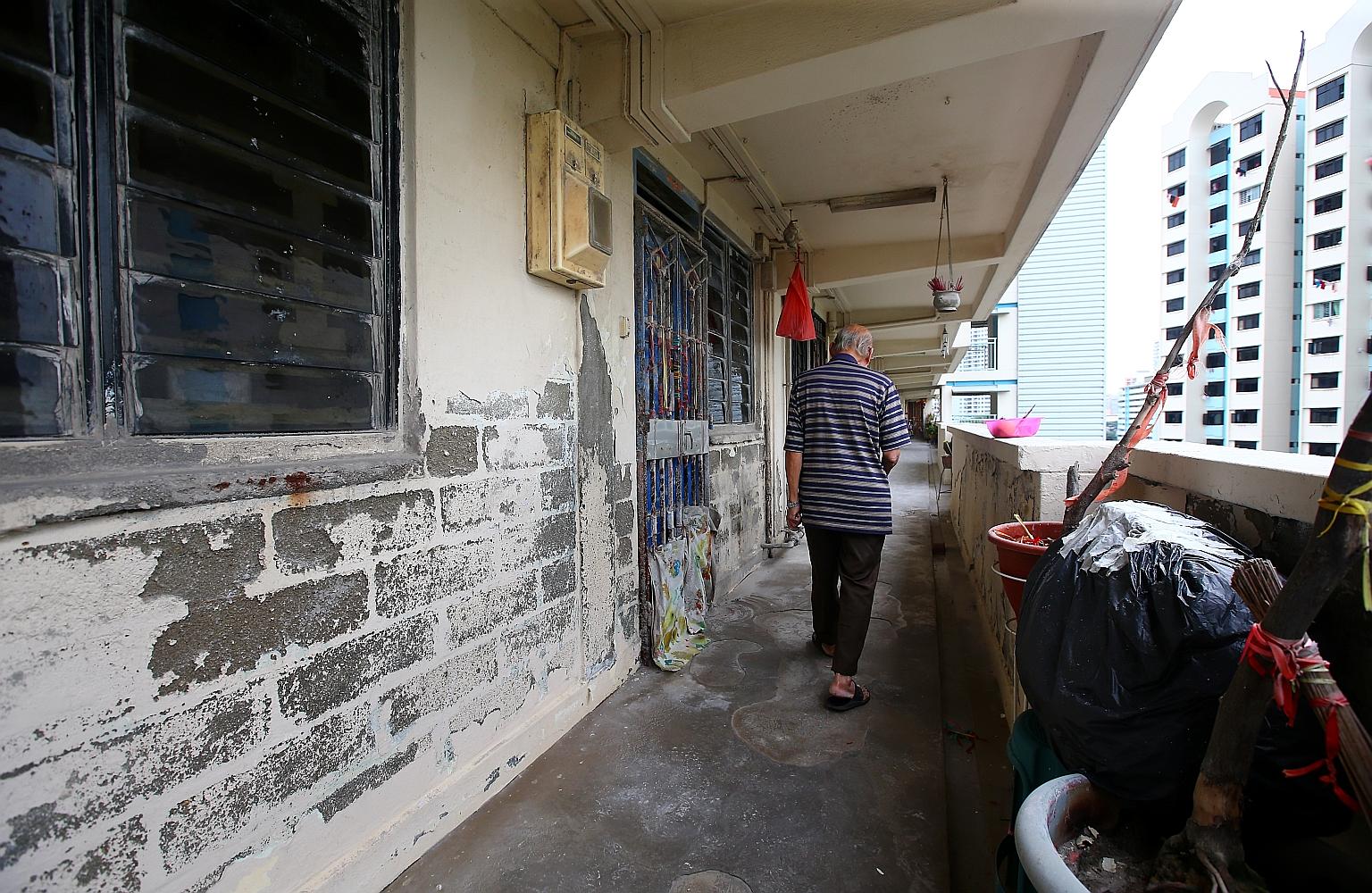 The woman, who lives in the rental flat with her husband, has been seen splashing a liquid outside her flat that caused paint on the walls to peel, exposing bare bricks.