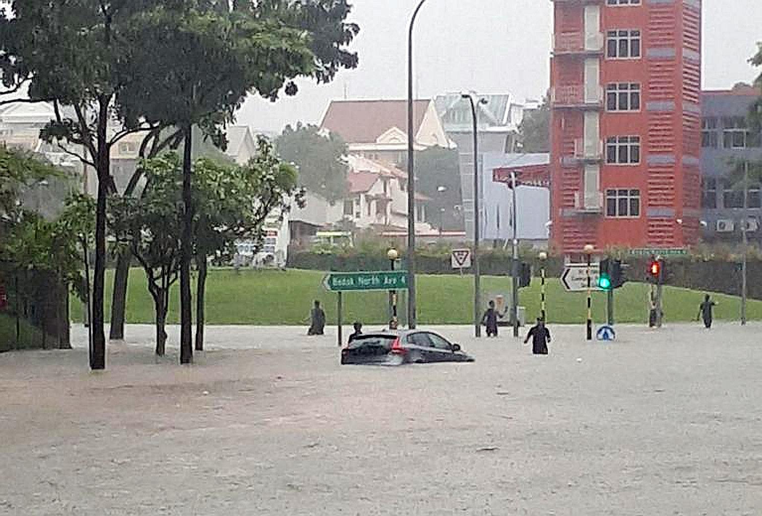 Flash floods hit nine areas in the east of Singapore yesterday morning, including the junction of Upper Changi Road and Bedok North Avenue 4.