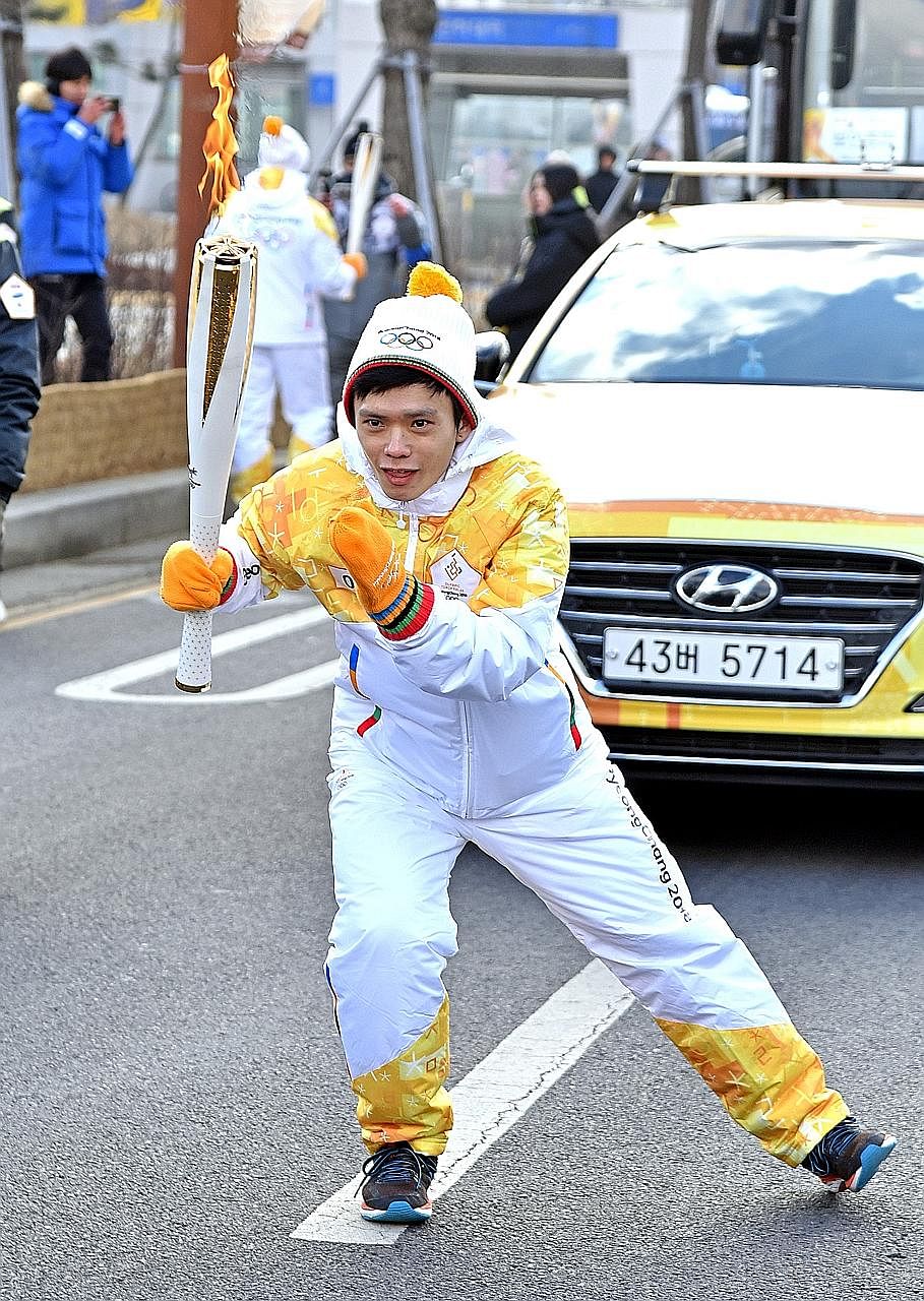 Lucas Ng channelling his inner short track speed skater self during his leg of the 2018 Pyeongchang Winter Olympics torch relay, in Incheon, South Korea - thanks to a tie-up between Samsung and The Straits Times. The 29-year-old Singaporean did not q