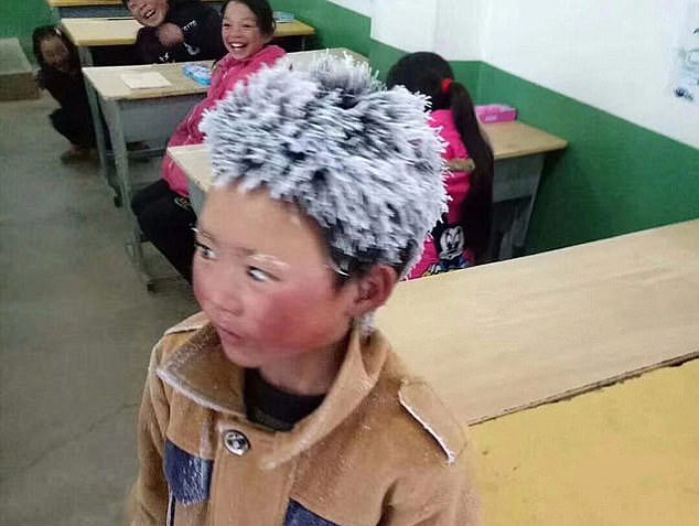 Enduring 9 deg C temperatures during his hour-long walk to school from home, Wang Fuman arrived in class with icicles on him. PHOTO: WEIBO