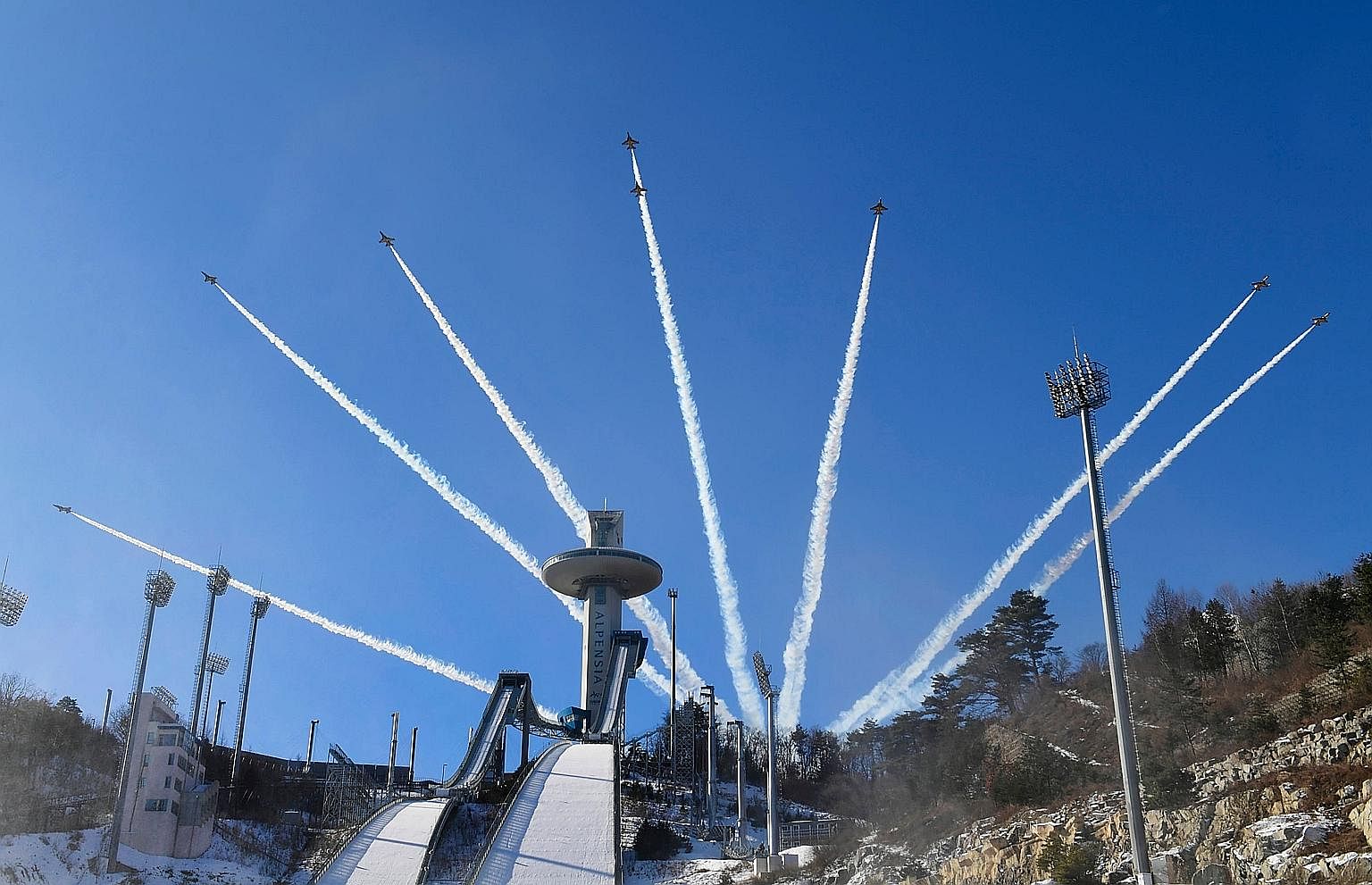 Members of the South Korean air force Black Eagle aerobatic team performing above the ski jump venue of the Pyeongchang 2018 Winter Olympics earlier this week. North Korea is sending a delegation consisting of athletes, high-ranking officials and a c