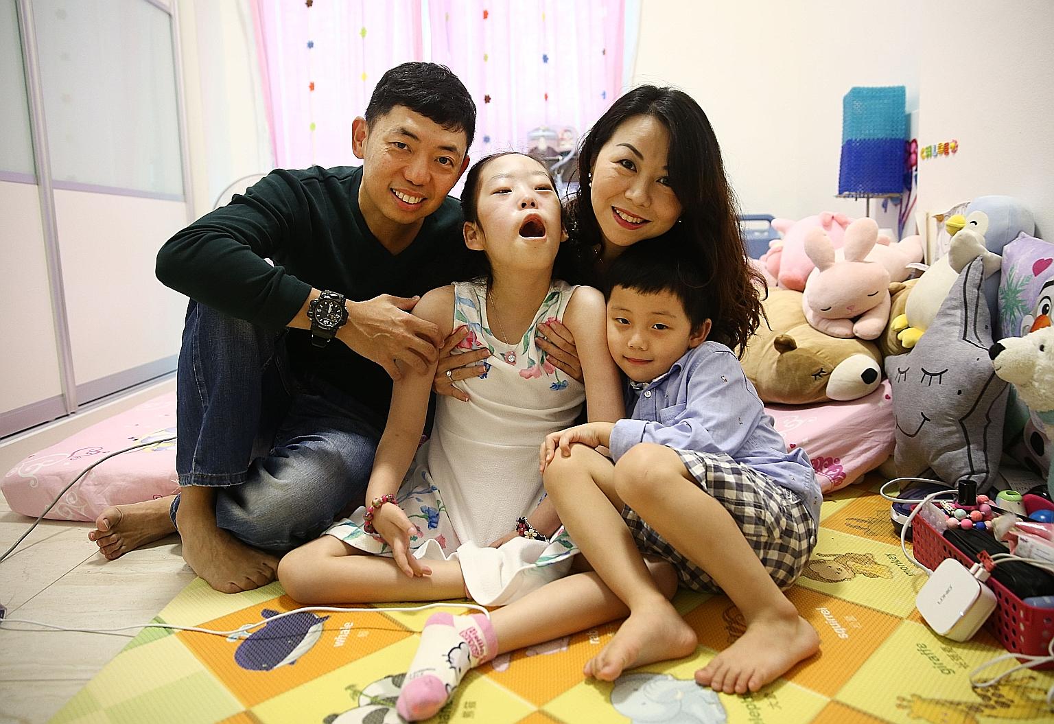 Mr Kenneth Mah and his wife Patricia with their children Chloe and Cayden. Nine-year-old Chloe has Pompe disease, which currently has no cure and can be fatal. Her treatment now easily reaches $40,000 a month.
