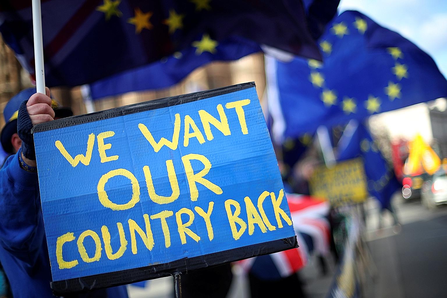 Anti-Brexit protesters near the Houses of Parliament in London on Tuesday.