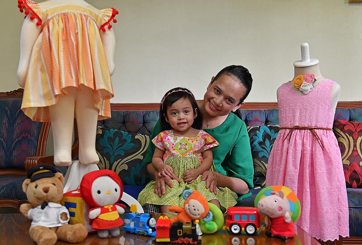 Ms Nurul Farah Niz sews clothes for her four children, including Dania, 11/2.