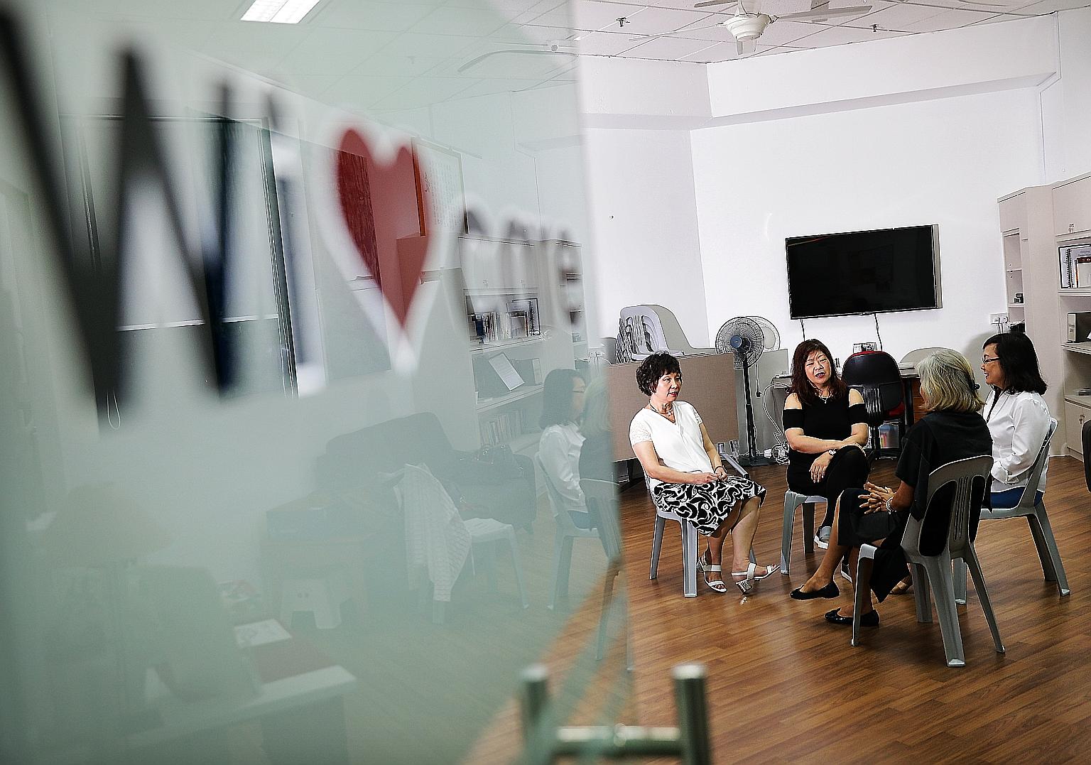 Two widows who have gone through the the Wishine programme are (facing camera from left) Madam Quek Puay Swan and Madam Julia Ng. They are seen here with Wicare chairman Lim Poh Hong and vice-chairman Esther Ng (back to camera). About 30 widows, aged