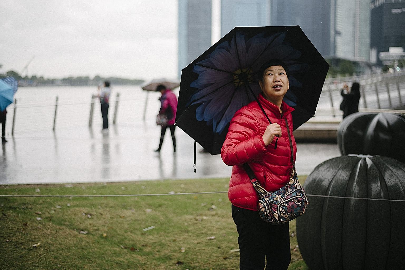 Last week's monsoon surge led to five days of cool but rainy weather, prompting some people to break out their winter wear.