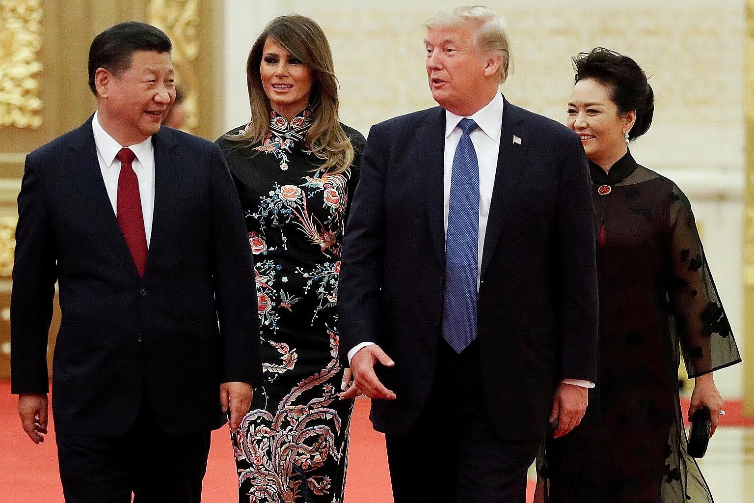 Above: US President Donald Trump and his wife Melania arriving for the state dinner with China's President Xi Jinping and First Lady Peng Liyuan at the Great Hall of the People in Beijing last November. Left: Mr Trump with (from far left) Vietnam Pri