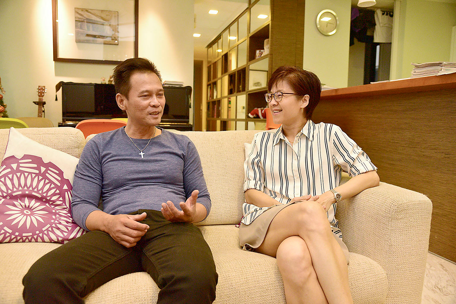 Mr Joel Lee Hong Seng and Madam Lorinne Kon in his one-room rental flat in Jalan Besar (left) and in her 1,600 sq ft condominium unit in Balestier. The close friends often chat over tea at a coffee shop near his flat.
