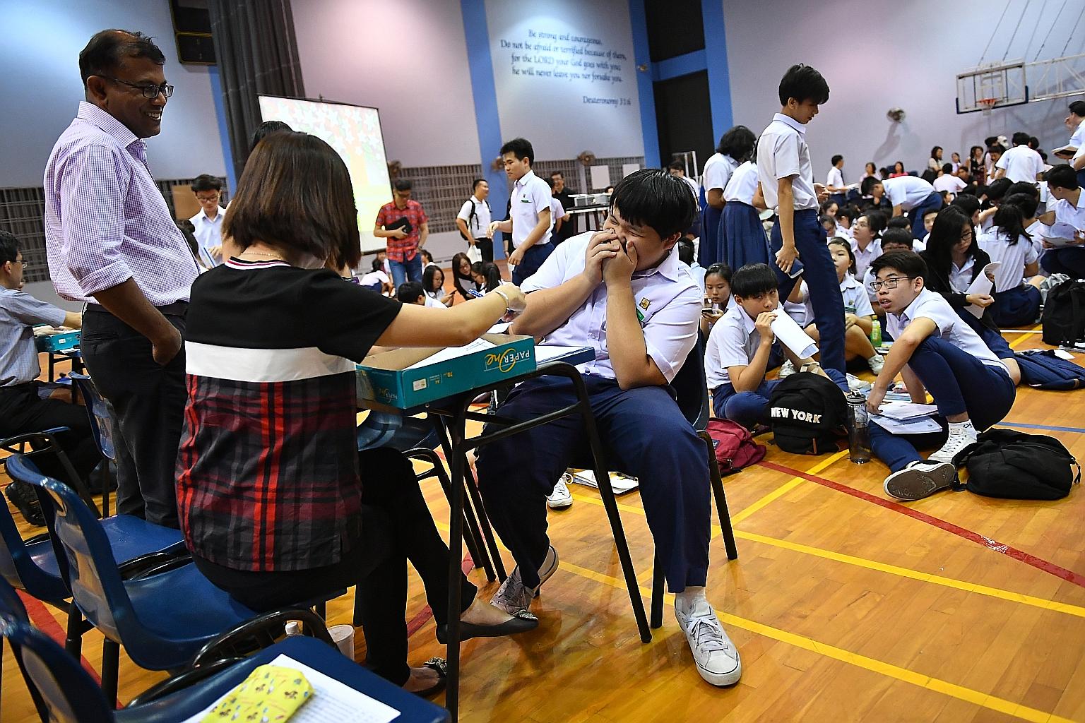Darren Lim receiving his GCE O-Level examination results at Presbyterian High School on Jan 12. Finding out the other areas your child excels in beyond academics will help to build up his confidence.
