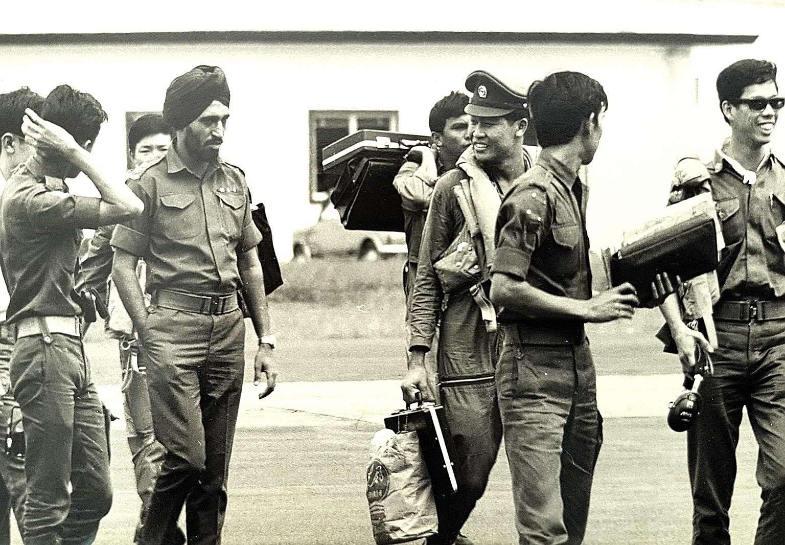 LT Leo Tin Boon (third from right), then a 21-year-old helicopter pilot, back in Singapore with the rest of the Kuantan detachment in 1971. It was the RSAF's - then the Singapore Air Defence Command - first humanitarian assistance and disaster relief