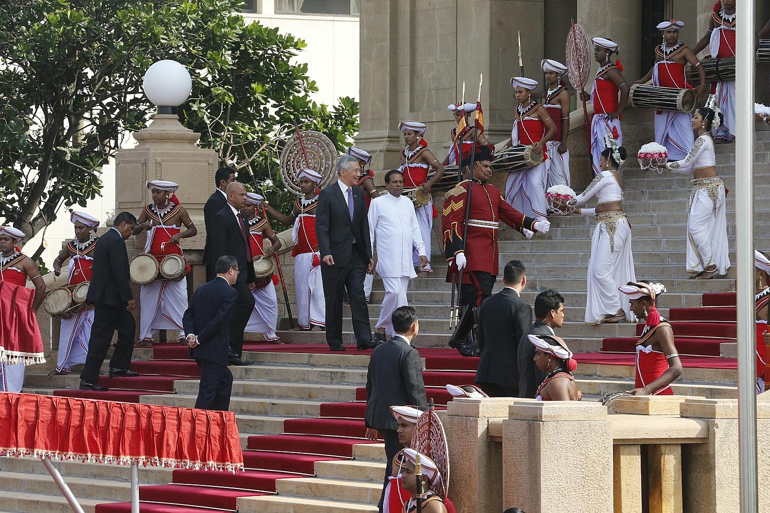 Prime Minister Lee Hsien Loong with Sri Lankan President Maithripala Sirisena at the Presidential Secretariat in Colombo yesterday. The two leaders later discussed education, trade, tourism, investments and drug policy, as well as ways to enhance coo