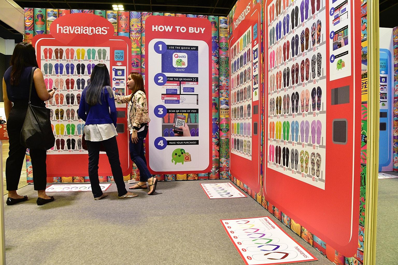The virtual supermart at the Qoo10 Super Sale 2018 features walls of product images from merchants. Each product will have a QR code which allows shoppers to buy the item, or redirects them to Qoo10's app or website on their smartphones for more info