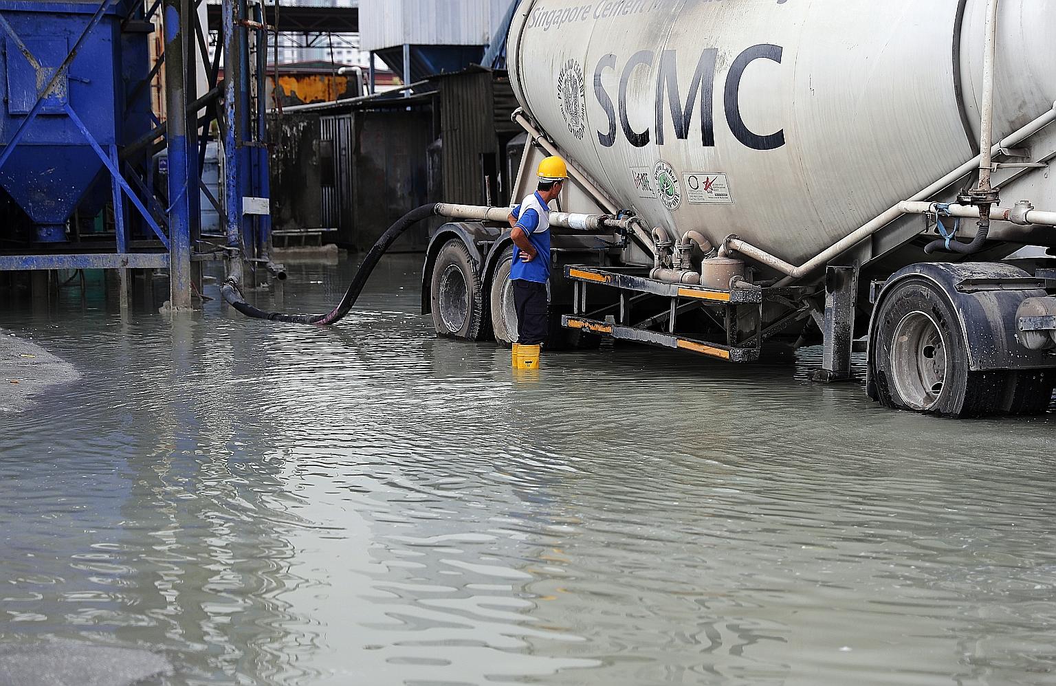 Heavy rain amid stormy weather yesterday led to flash floods in Seletar North (above) as well as uprooted trees in Yishun and Yio Chu Kang. Some people reported seeing hailstones falling with the rain.