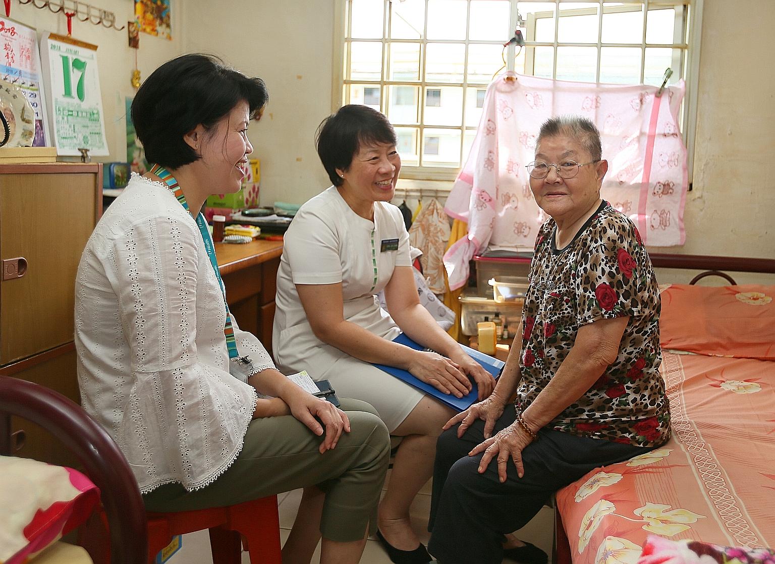 Madam Tan Sok Ngo, 78, was not readmitted to hospital after she was cared for under the Esther Network Singapore scheme. She is seen here with Ms Seng Gek Siang (centre), patient navigator, Singapore General Hospital, and Ms Audrey Leo, care manager,