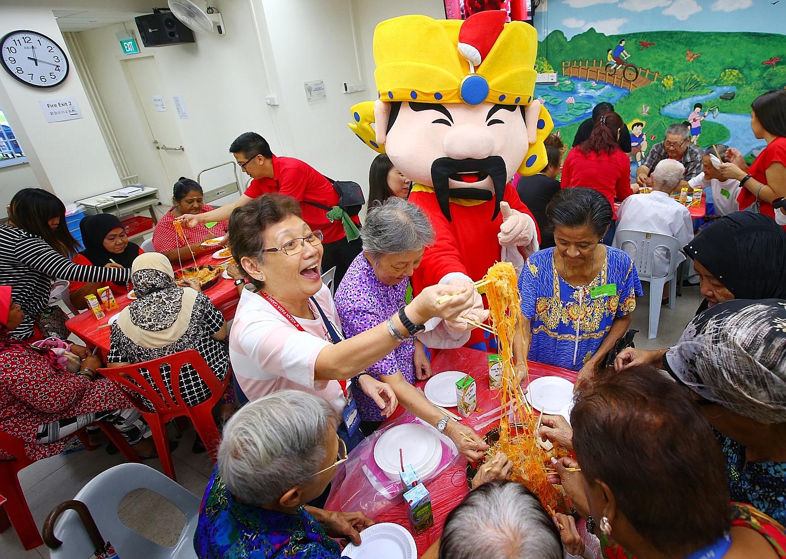 More than 20 staff from Singapore Press Holdings (SPH) distributed festive goodie bags to 170 senior citizens at Lions Befrienders (Ang Mo Kio) Senior Activity Centre yesterday. As part of the SPH Staff Volunteers Club's annual "SPH Cares with Bags o