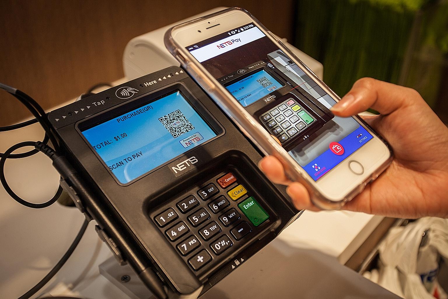 Consumers can pay for their groceries at selected supermarket outlets with their mobile phones, using an app to scan a QR code.