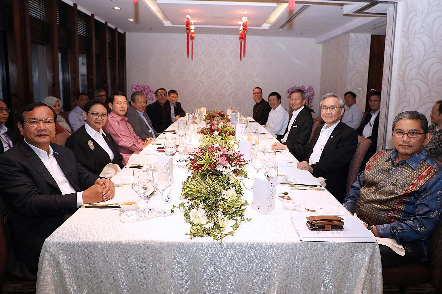 Clockwise from left: Asean diplomats Prak Sokhonn from Cambodia, Retno Marsudi from Indonesia, Saleumxay Kommasith from Laos, Anifah Aman from Malaysia, Kyaw Tin from Myanmar, Asean Secretary-General Lim Jock Hoi, Alan Cayetano from the Philippines, 