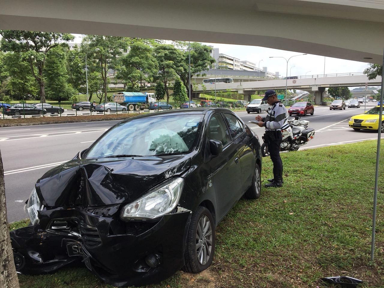 Car mounts kerb, crashes into tree in Braddell | The Straits Times