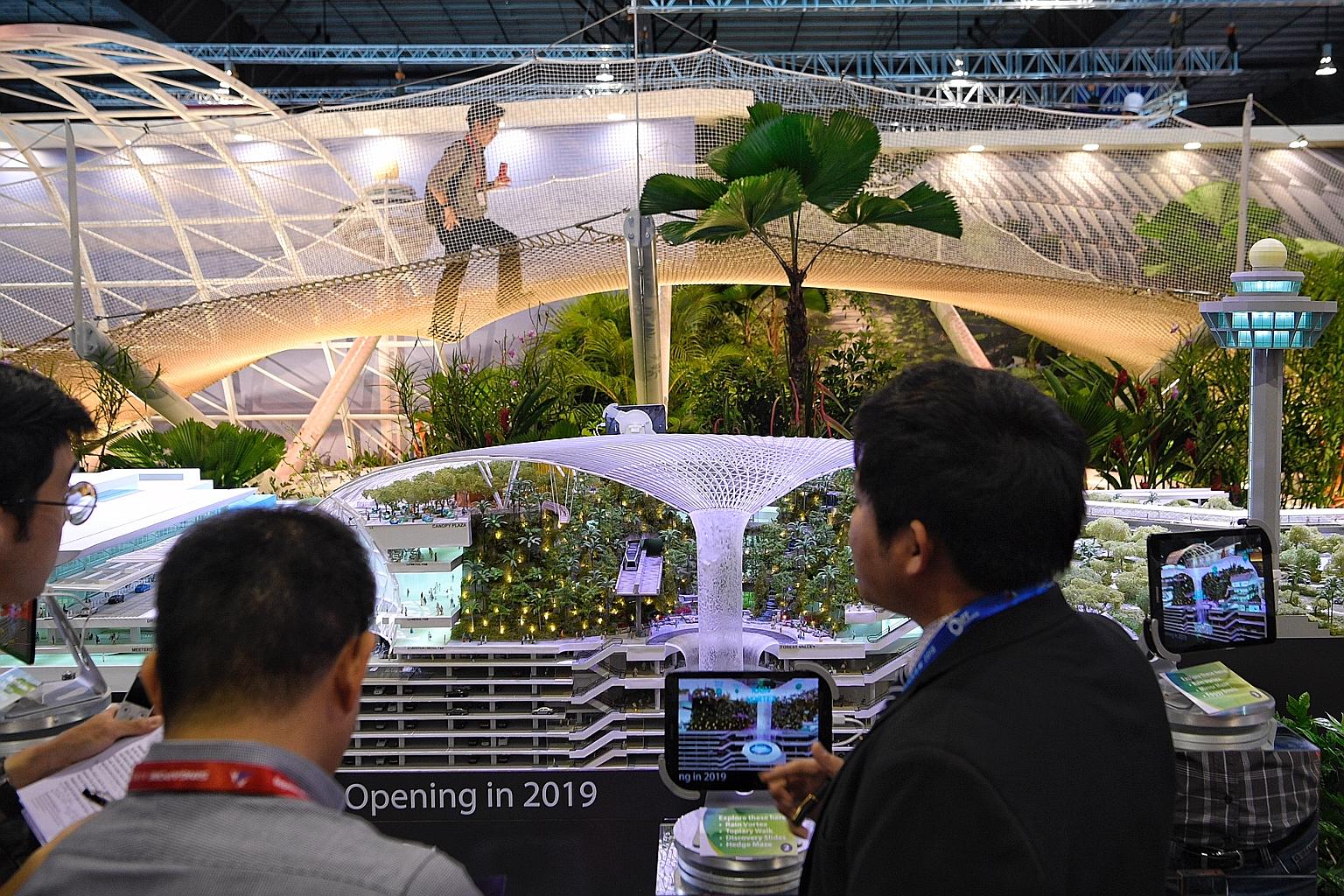 Visitors to the Singapore Airshow had some fun bouncing on a 20m-by-8m net set up at Changi Airport Group's (CAG) exhibition booth yesterday. The net is a small replica of the Sky Nets attraction, one of the highlights at the upcoming Jewel Changi Ai