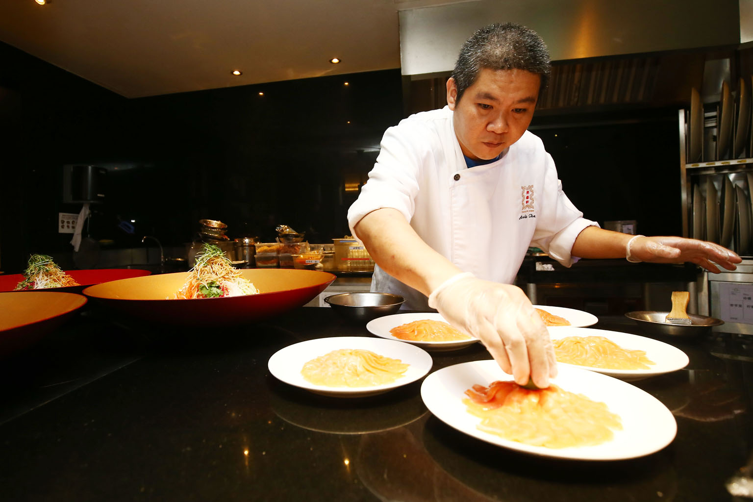 Food being prepared at TungLok Signatures. The Chinese restaurant chain is one of the firms working with the HPB to re-work dishes to include sugar alternatives. Many Asian foods such as pad thai and sambal chilli rely on sugar to bring out the flavo