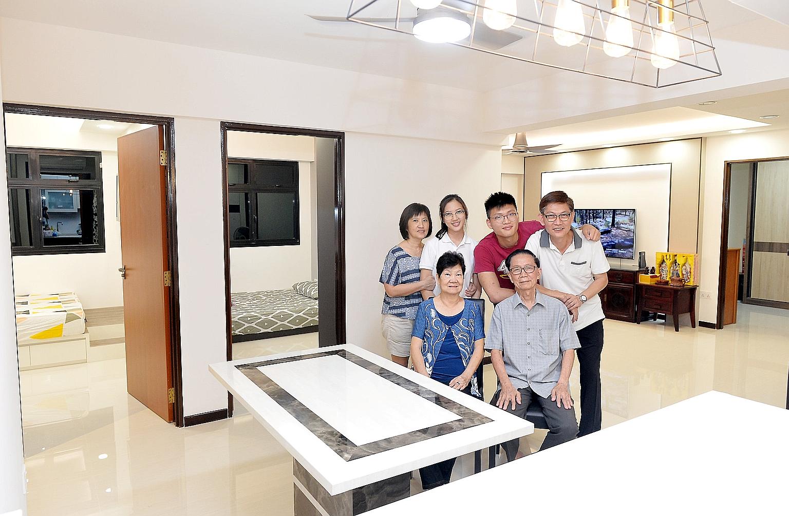 Mr Wong Khai Beng (standing, far right), 55, with his parents - Mr Wong Chong Hwee, 83, and Madam Lai Su Lan, 77, - his wife, Madam Ooi Guat Yian, 55, and their children - Rou Xuan (standing second from left), 19, and Jia Yi, 22 - in their new three-