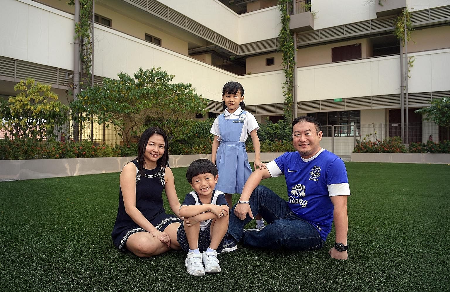 Mr Edwin Chan with his wife, Ms Cecilia Chiang, 40, and their children, Jade, eight, and Jackie, six, at the Cannosian Eduplex. Mr Chan is glad that his son will be able to join his daughter, who is in Primary 2, at Canossa Convent Primary when it st