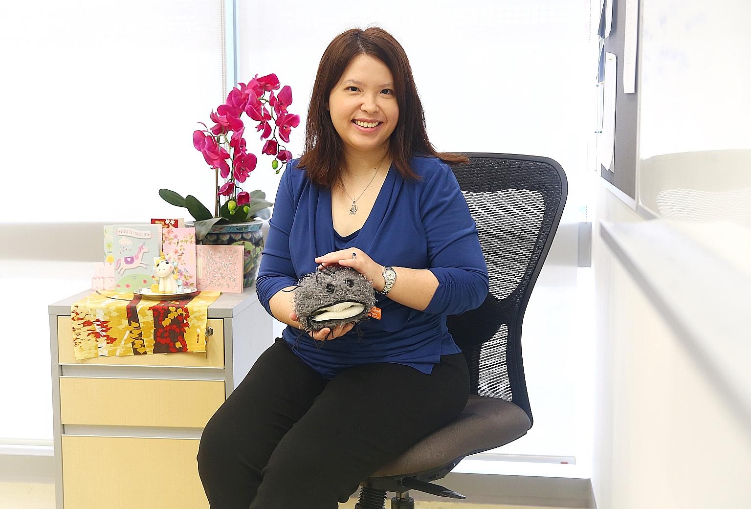 NTU professor Melissa Fullwood, seen here holding a cancer cell soft toy, is also a principal investigator at the Cancer Science Institute of Singapore. She says there are more men than women in the sciences, although there is "about an an equal numb