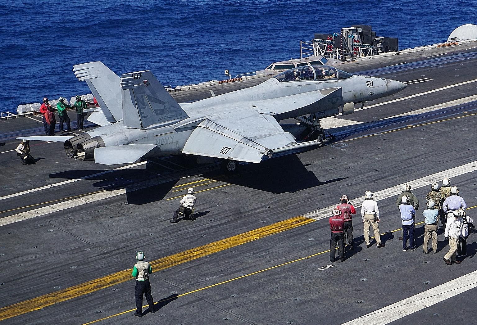 An F-18 Hornet fighter jet set for take-off from the flight deck of aircraft carrier USS Carl Vinson during a routine deployment in the South China Sea this month. The writer believes that while the US still has an overall military advantage over Chi