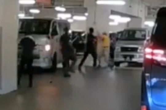 In a video of the incident, the men can be seen fighting each other, before passers-by broke the fight up.