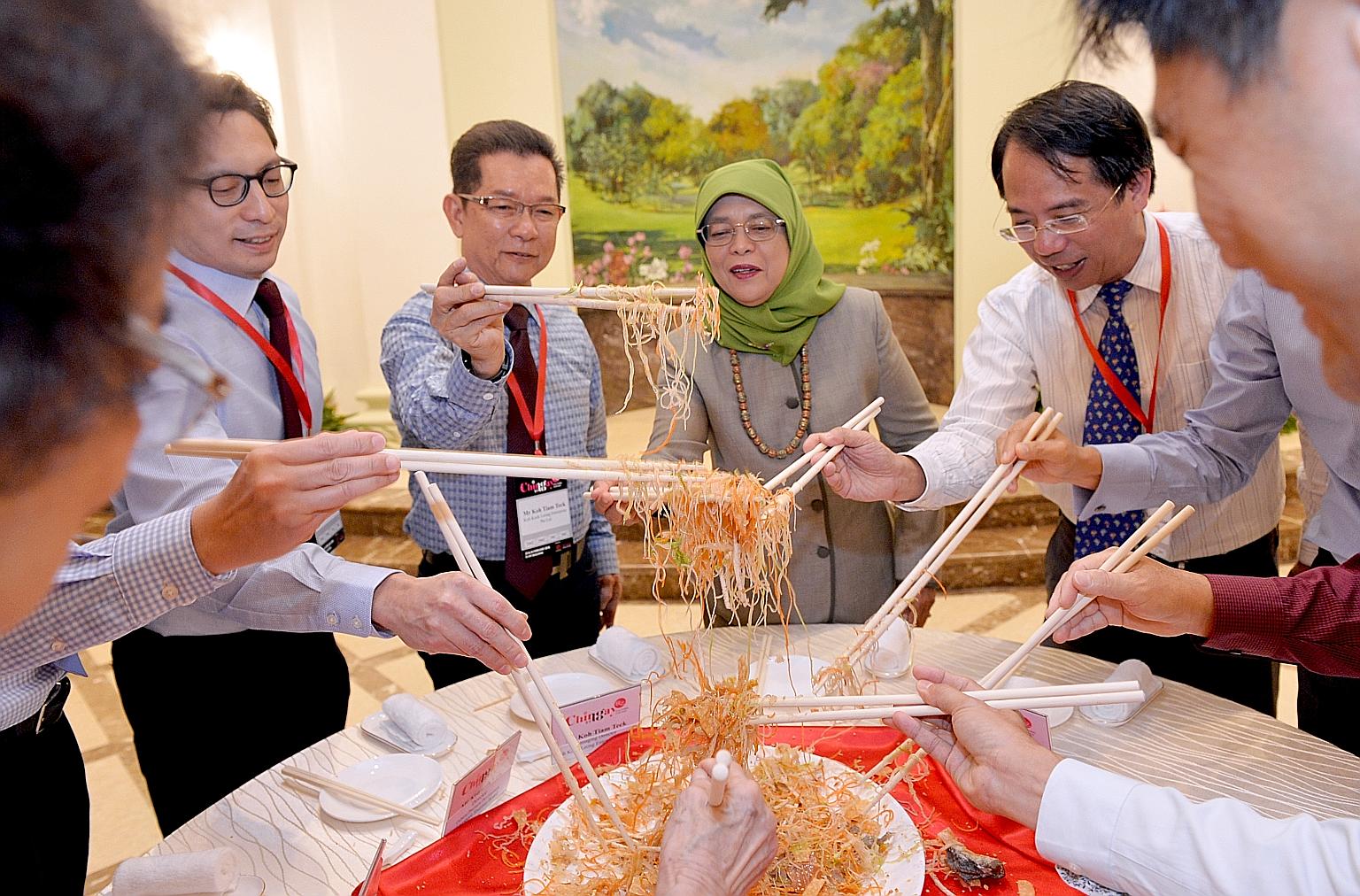 The Chingay parade may be over, but the festive fun continued at the Istana yesterday, with President Halimah Yacob thanking key contributors of this year's parade by inviting them to lunch and joining them to toss yusheng for good fortune. With her