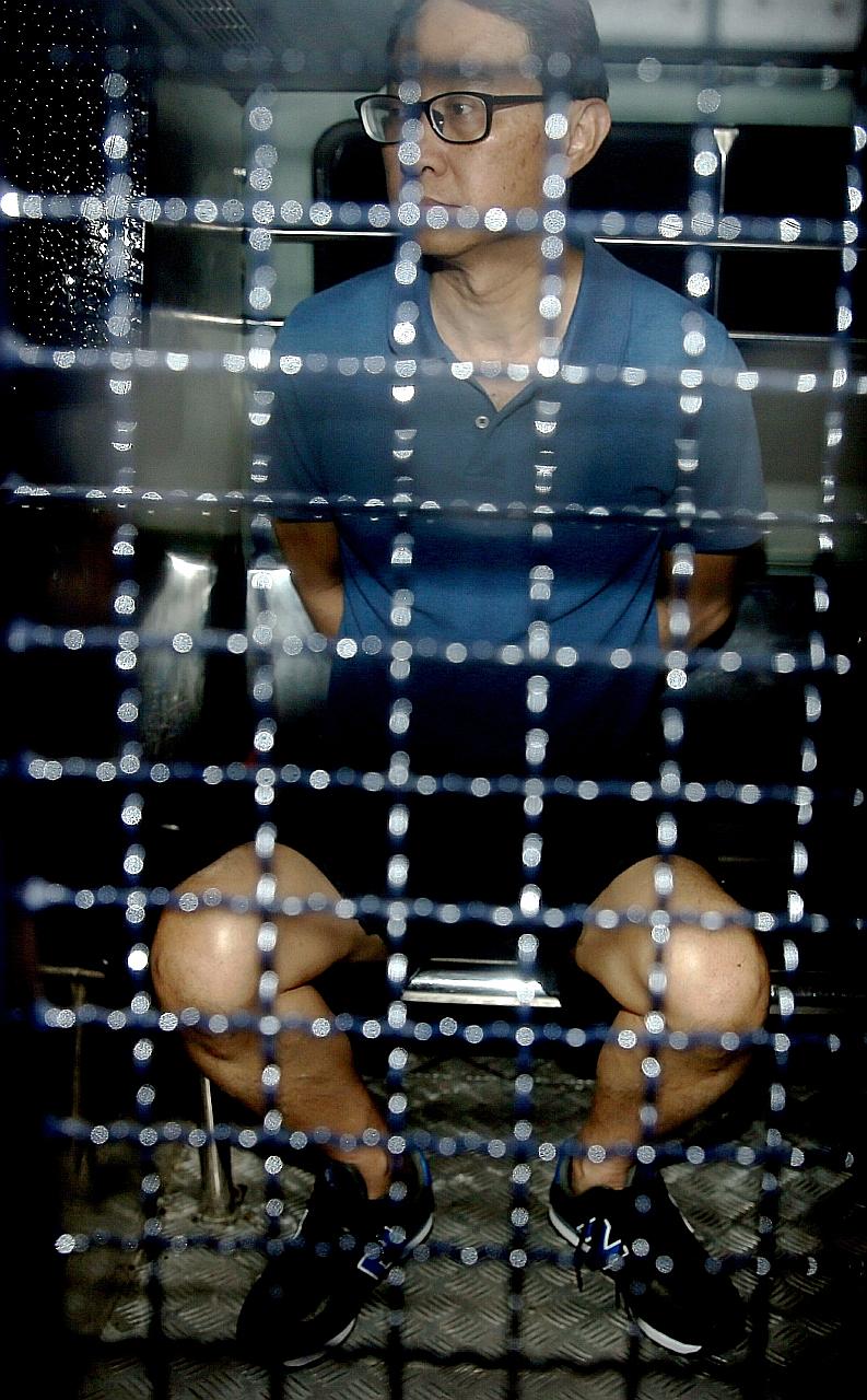 Chew Eng Han (left) and Tan Poh Teck were nabbed at sea on Feb 21. Chew is accused of leaving Singapore unlawfully at Pulau Ubin Jetty - which is not an authorised place of embarkation, departing place or point of departure - by boarding Tan's motori